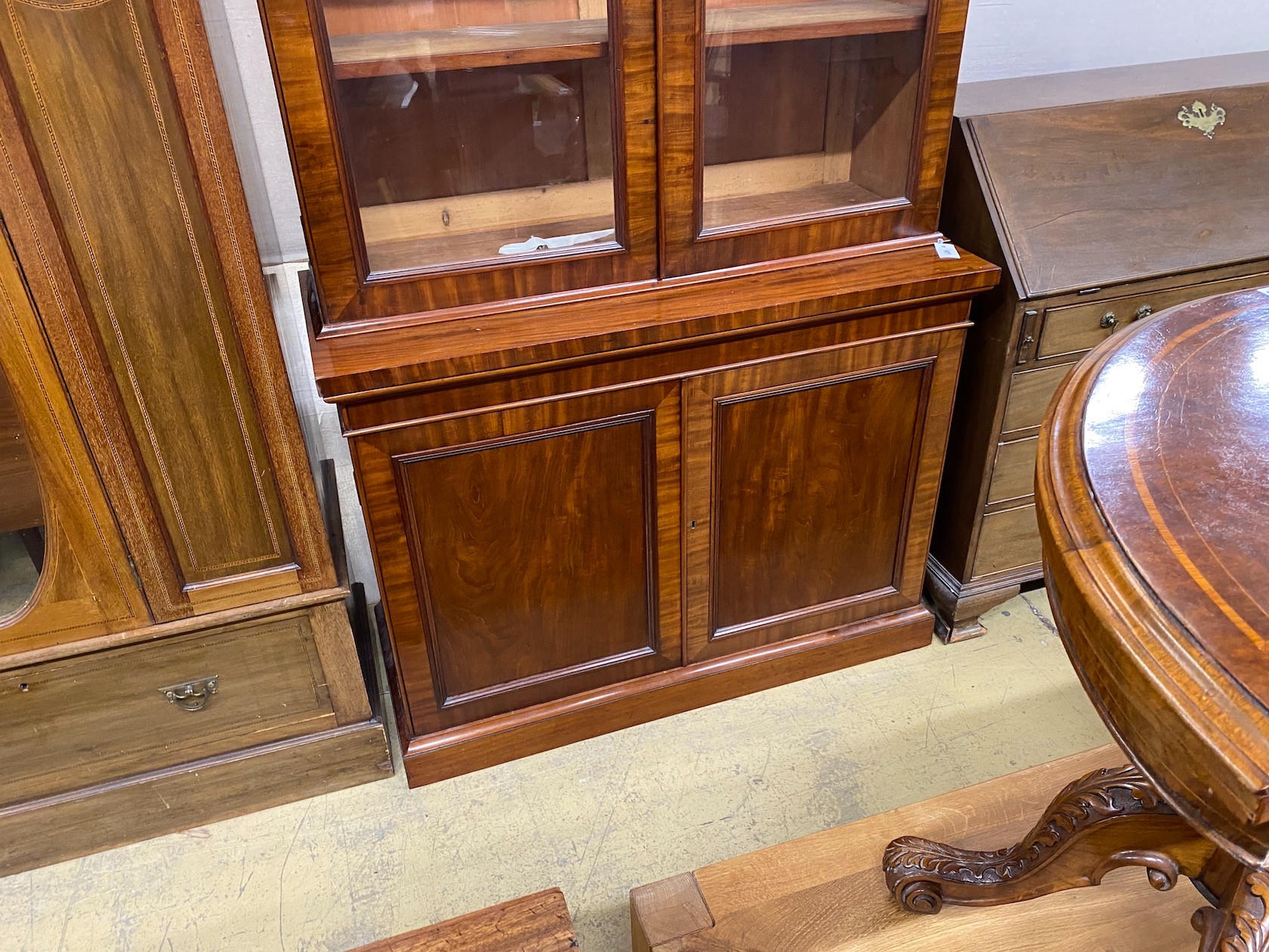 A Victorian mahogany bookcase cupboard width 118cm, depth 49cm, height 217cm.
